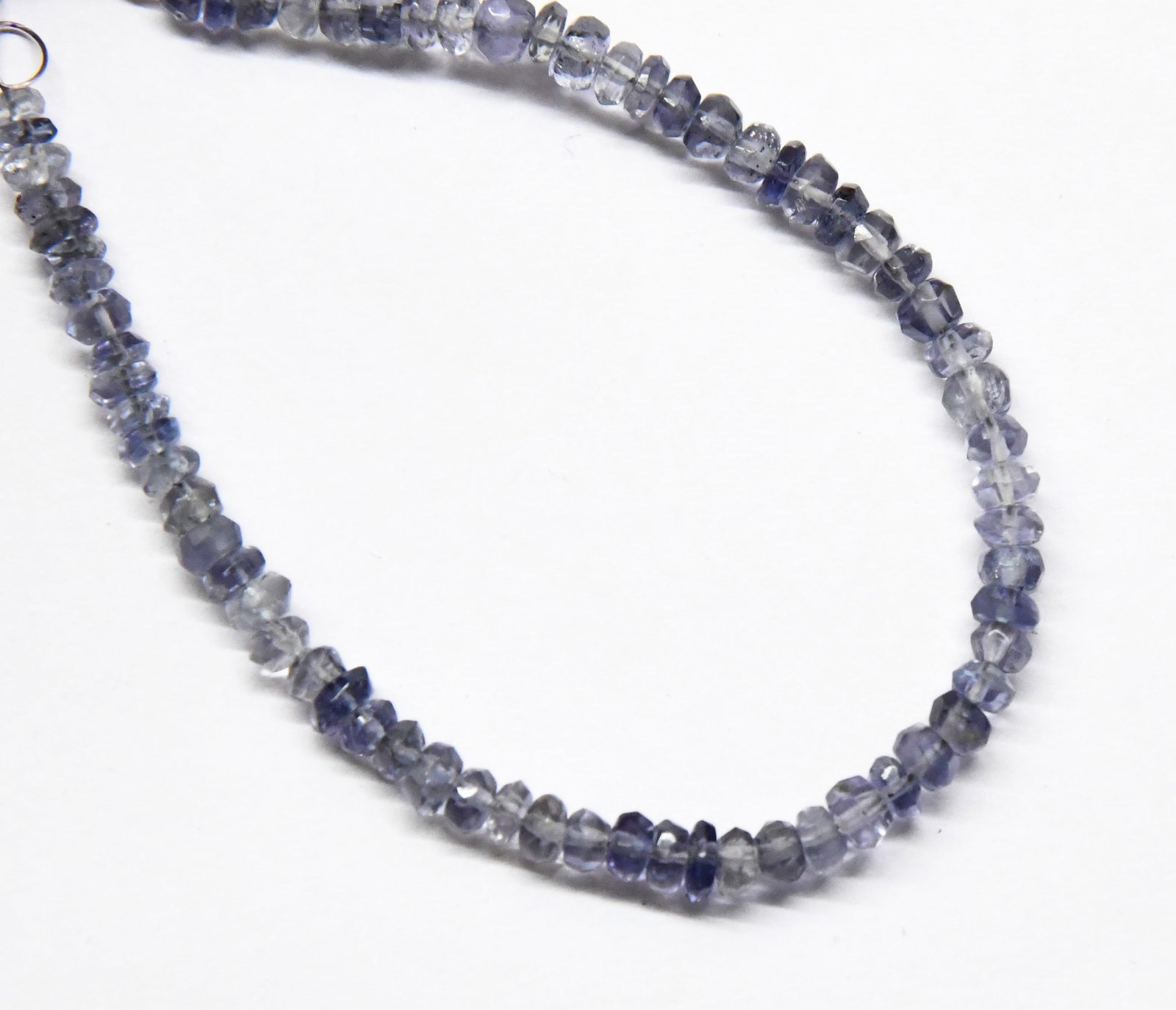 NATURAL IOILTE BEADS FACETED RONDELLE 3.5 - 4 MM, 5" STRAND: These are natural, earth mined and hand crafted with precision. Stone: Iolite, Stone Shape: Faceted Rondelle, Stone Size: 3.5 - 4 mm, Width: 1.5 - 2 mm, Weight: approx. 16 carats. The photographs are