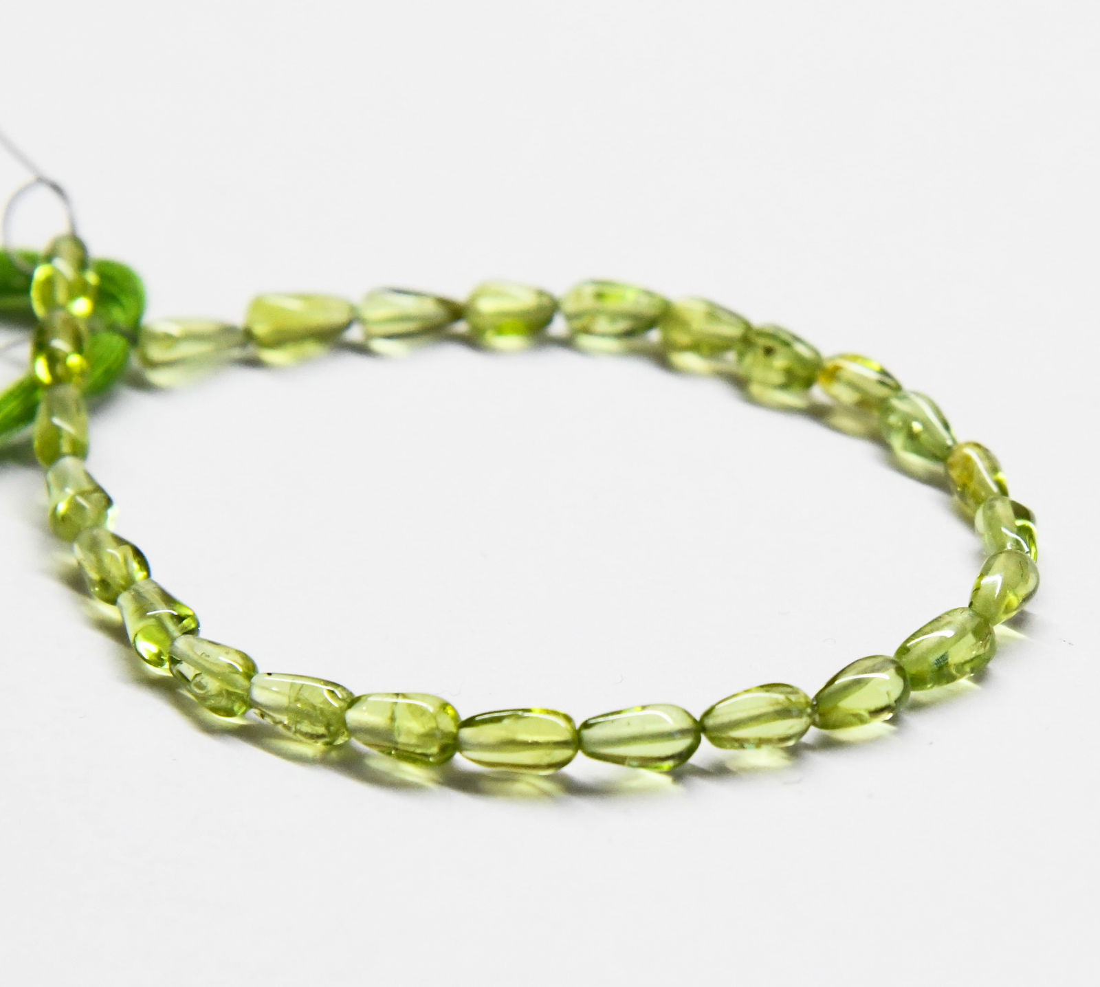 NATURAL PERIDOT BEADS BRIOLETTE 3X6 - 3X7 MM, 6" LINE (1 of 2)