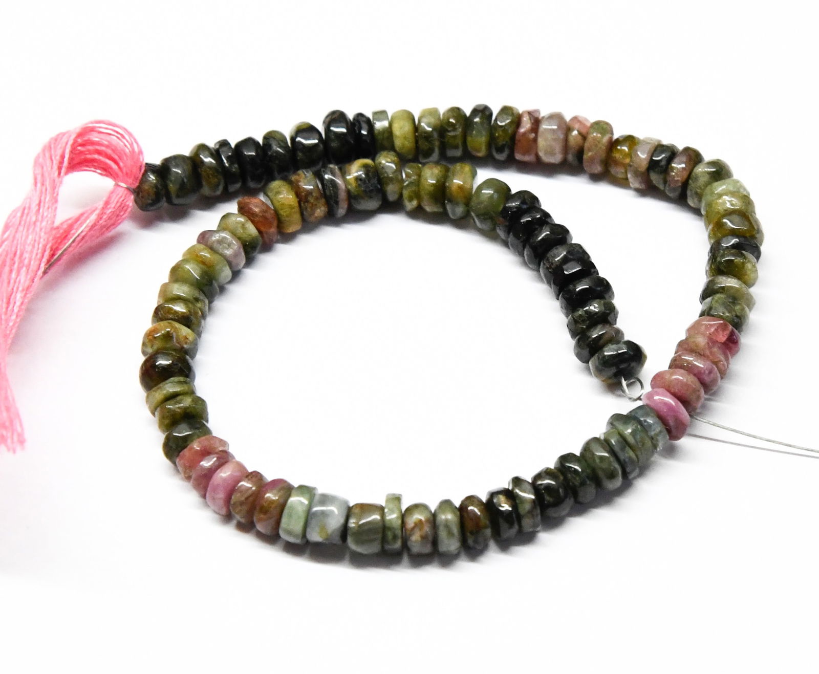 NATURAL MULTI TOURMALINE BEADS TYRE 4.5 - 5 MM, 8" LINE: These are natural, earth mined and hand crafted with precision. Stone: Multi Tourmaline, Stone Shape: Tyre, Stone Size: 4.5 - 5 mm, Width: 1.5 - 3 mm, Weight: approx. 56 carats. The photographs are ge