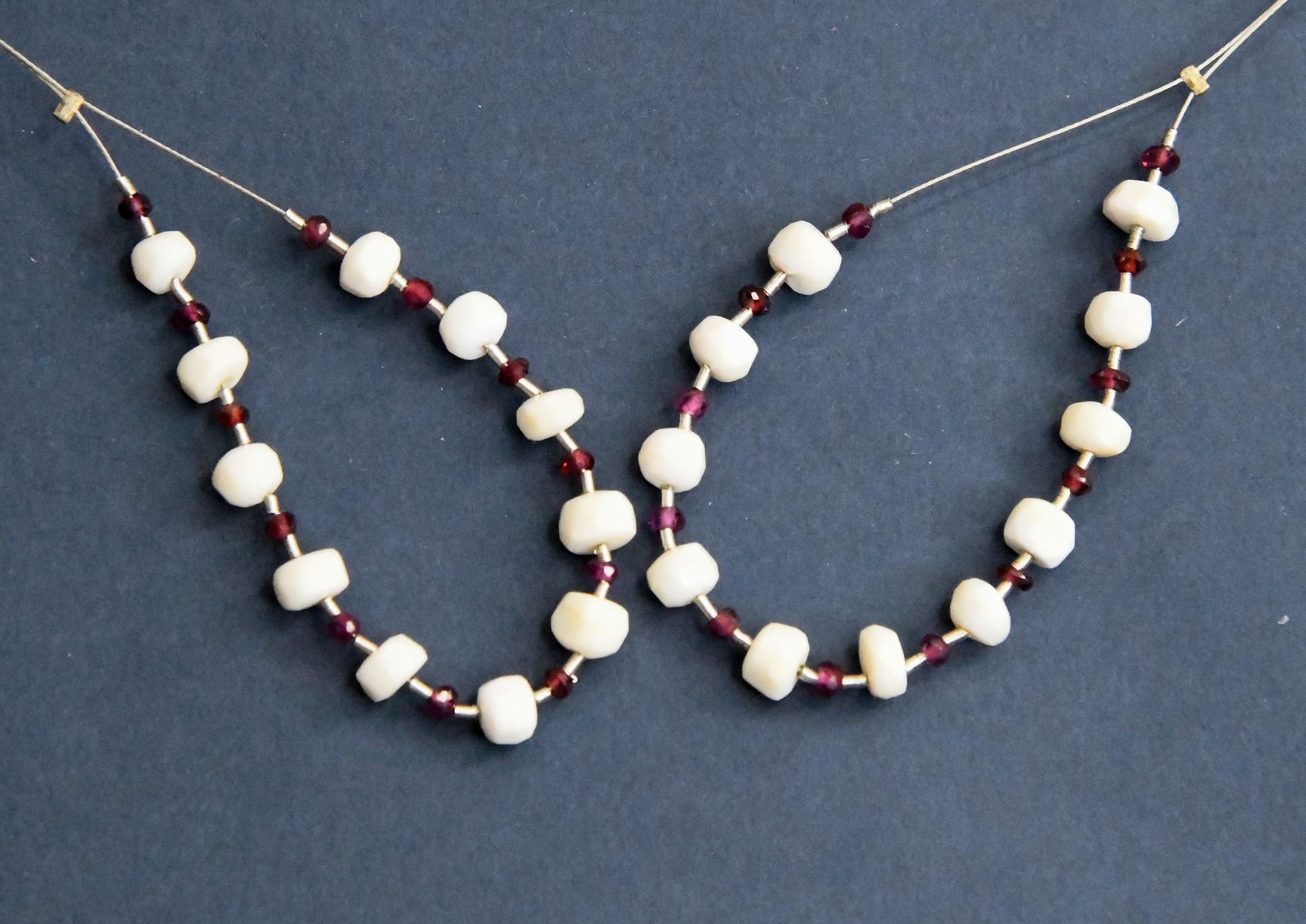 NATURAL AUSTRALIAN OPAL & GARNET BEADS FACETED RONDELLE 2 - 5 MM, 23 PCS (2 TASSELS): These are natural, earth mined and hand crafted with precision. Stone: Australian Opal/Garnet, Stone Shape: Faceted Rondelle, Stone Size: 2 - 5 mm, Width: 2 - 3 mm, Weight: approx. 9 carats. The photo