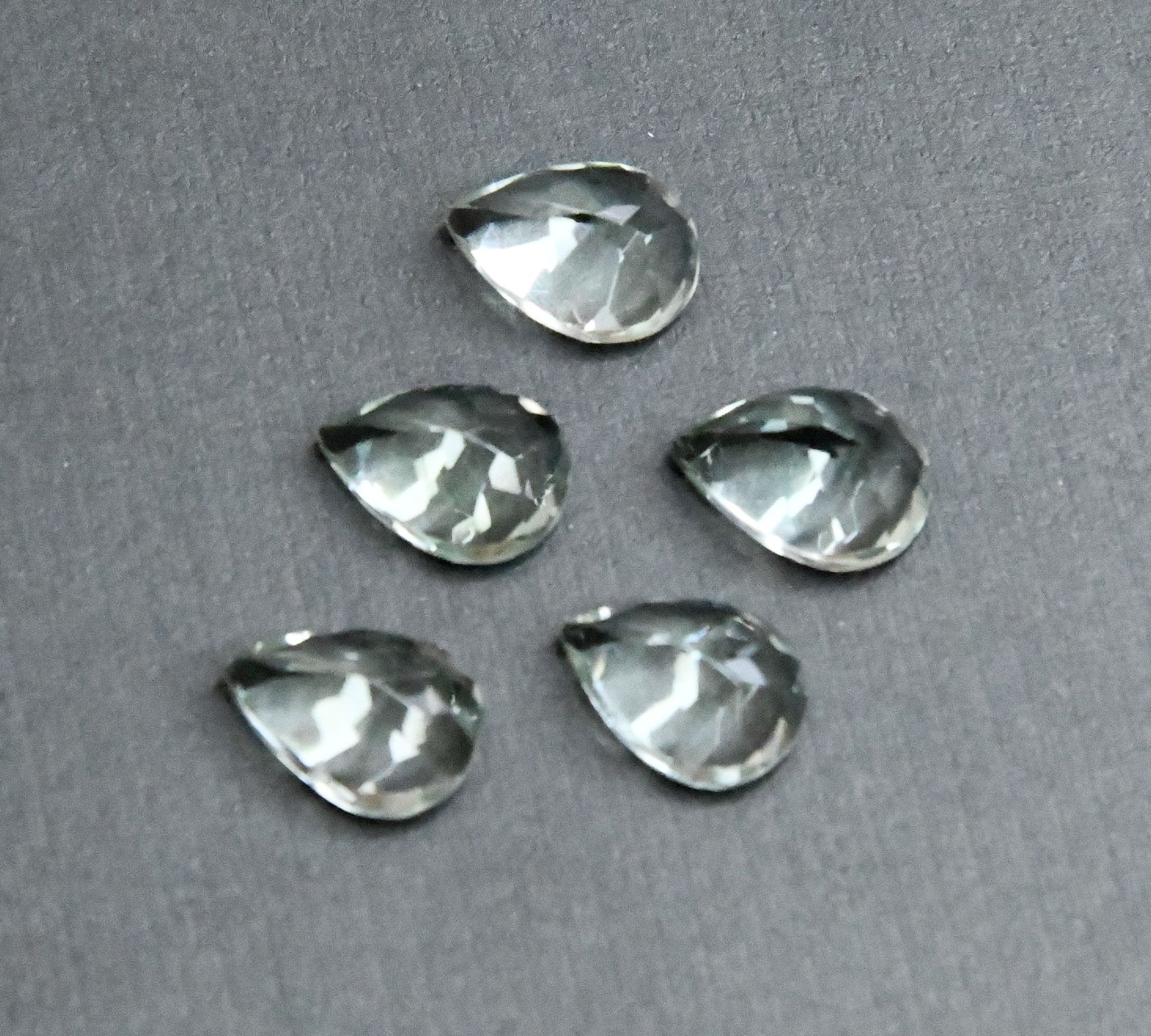 NATURAL GREEN AMETHYST BEADS FACETED PEAR 9.5X 13.5 MM - (5 PIECES): These are natural, earth mined and hand crafted with precision. Stone: Green Amethyst, Stone Shape: Faceted Pear, Stone Size: 9.5x13.5 mm, Width: 6 - 7 mm, Weight: approx. 23.50 carats. The photograph