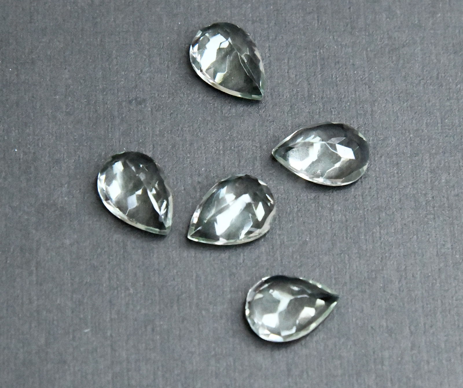 NATURAL GREEN AMETHYST BEADS FACETED PEAR 9.5X 13.5 MM - (5 PIECES): These are natural, earth mined and hand crafted with precision. Stone: Green Amethyst, Stone Shape: Faceted Pear, Stone Size: 9.5x13.5 mm, Width: 5.5 - 6.5 mm, Weight: approx. 21.50 carats. The photog