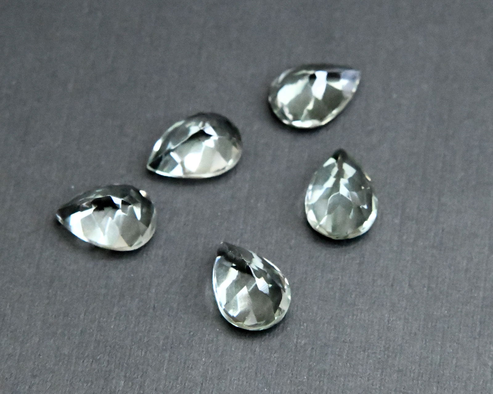 NATURAL GREEN AMETHYST BEADS FACETED PEAR 9.5X 13.5 MM - (5 PIECES): These are natural, earth mined and hand crafted with precision. Stone: Green Amethyst, Stone Shape: Faceted Pear, Stone Size: 9.5x13.5 mm, Width: 6 - 8 mm, Weight: approx. 25 carats. The photographs a