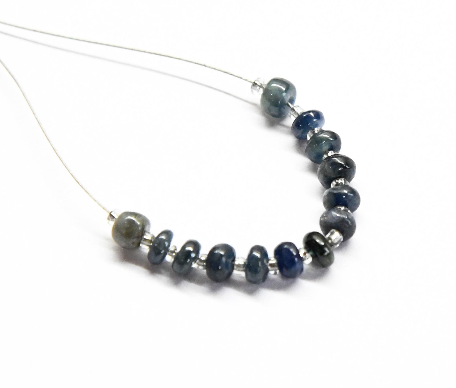 NATURAL BLUE SAPPHIRE BEADS RONDELLE 3.5 - 4 MM 13 PCS (3 TASSELS): These are natural, earth mined and hand crafted with precision. Stone: Blue Sapphire, Stone Shape: Rondelle, Stone Size: 3.5 - 4 mm, Width:1.5 - 2.5 mm, Weight: approx. 5.40 carats. The photographs ar