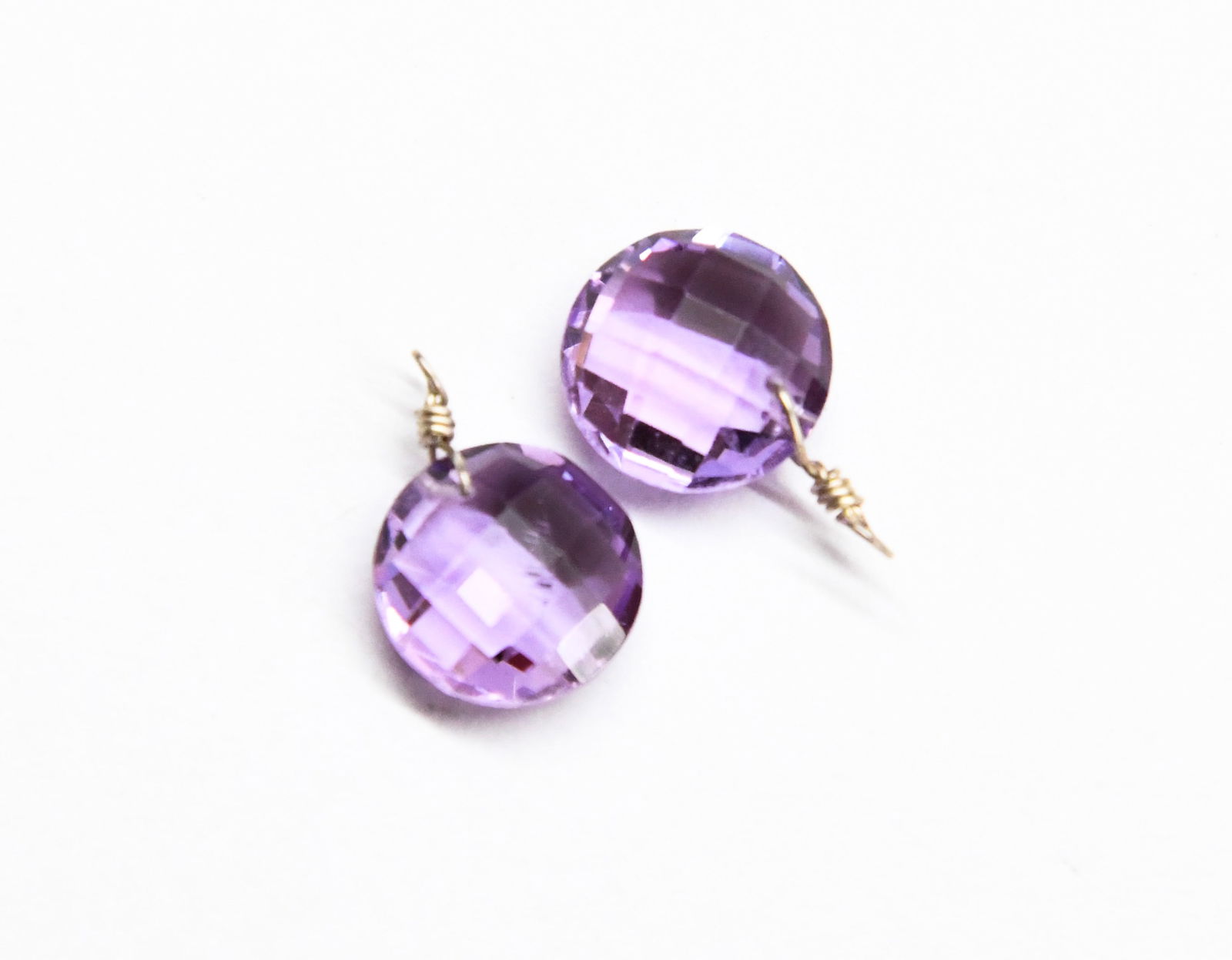 NATURAL AMETHYST BEADS FACETED COIN 10 MM - 1 PAIR: These are natural, earth mined and hand crafted with precision. Stone: Amethyst, Stone Shape: Faceted Coin, Stone Size: 10 mm, Width: 4.5 - 5 mm, Weight: approx. 6 carats. The photographs are enlarged