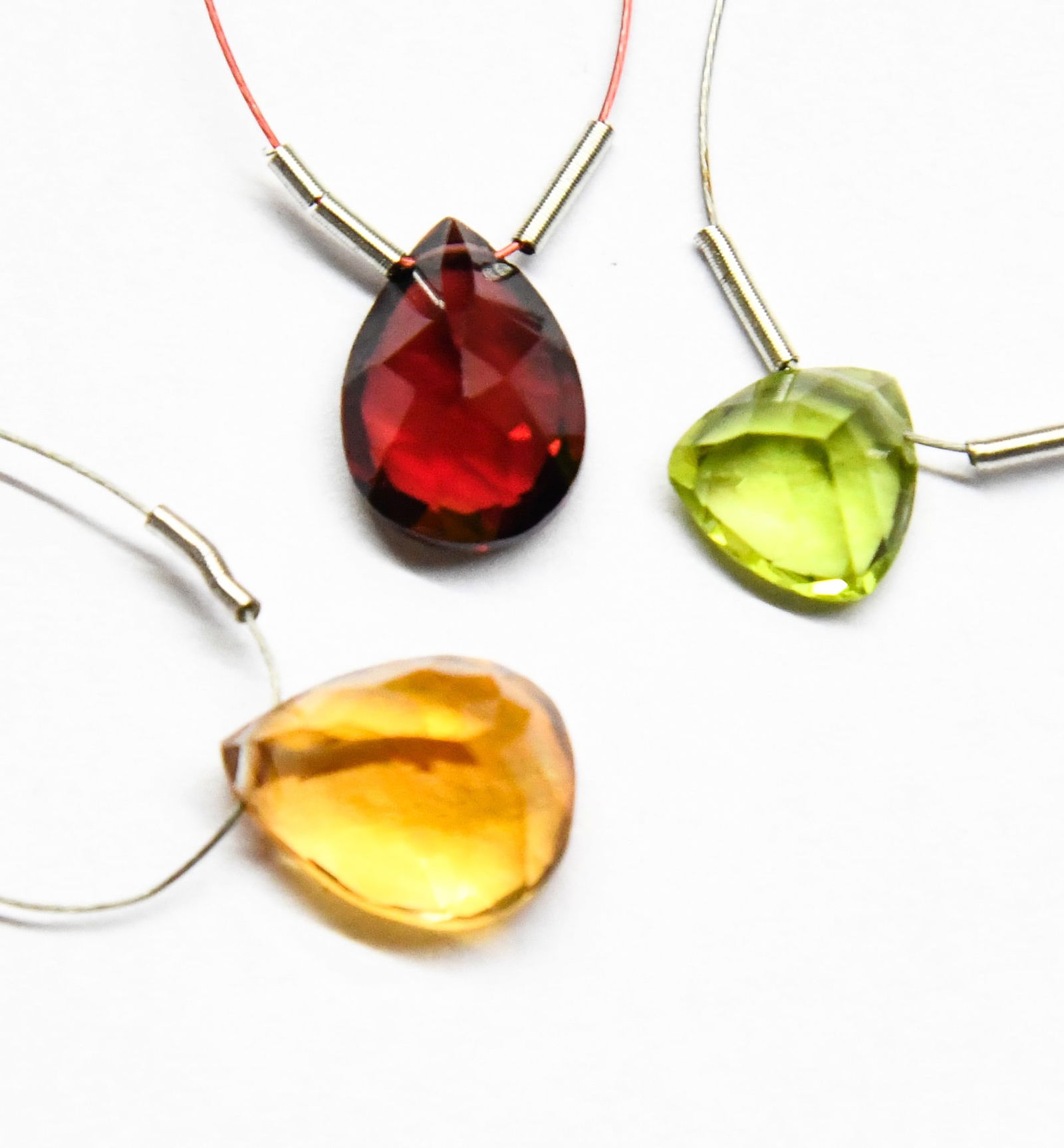 NATURAL GARNET, CITRINE, PERIDOT BEADS FACETED PEAR/TRIANGLE 8 - 9X11.5 MM, 3 PCS: These are natural, earth mined and hand crafted with precision. Stone: Garnet/Citrine/Peridot, Shape: Faceted Pear/Triangle, Size: 8 - 9x11.5 mm, Width: 4 - 7 mm, Weight: approx. 9 carats. The photogr