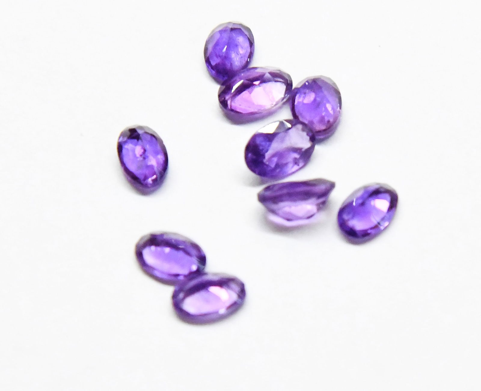 NATURAL AMETHYST FACETED CUTSTONE OVAL 4X6 MM 10 PCS: These are natural, earth mined and hand crafted with precision. Stone: Amethyst, Shape: Faceted Oval, Size: 4x6 mm, Width: 2.5 - 3 mm, Weight: approx. 4 carats. The photographs are enlarged to show th