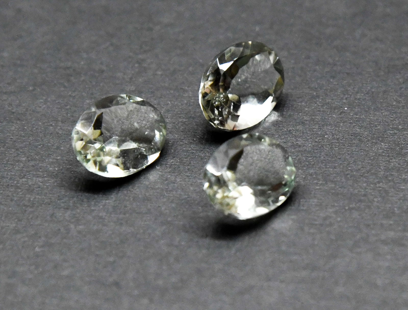 NATURAL GREEN AMETHYST FACETED CUTSTONE OVAL 9.5X13.5 MM 3 PCS: These are natural, earth mined and hand crafted with precision. Stone: Green Amethyst, Shape: Faceted Oval, Size: 9.5x13.5 mm, Width: 5.5 - 7 mm, Weight: approx. 14 carats. The photographs are enlarge