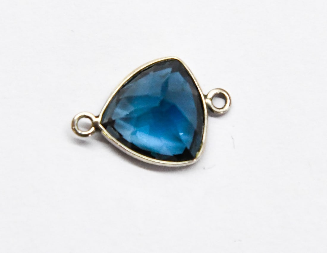 SOLID 925 STERLING SILVER - NATURAL BLUE TOPAZ FACETED TRIANGLE 12 MM 1 PC: These are natural, earth mined and hand crafted with precision. Stone: London Blue Topaz, Shape: Faceted Triangle, Size: 12x12 mm, Width: 7 mm, Weight: approx. 7 carats. The photographs are enlarged t