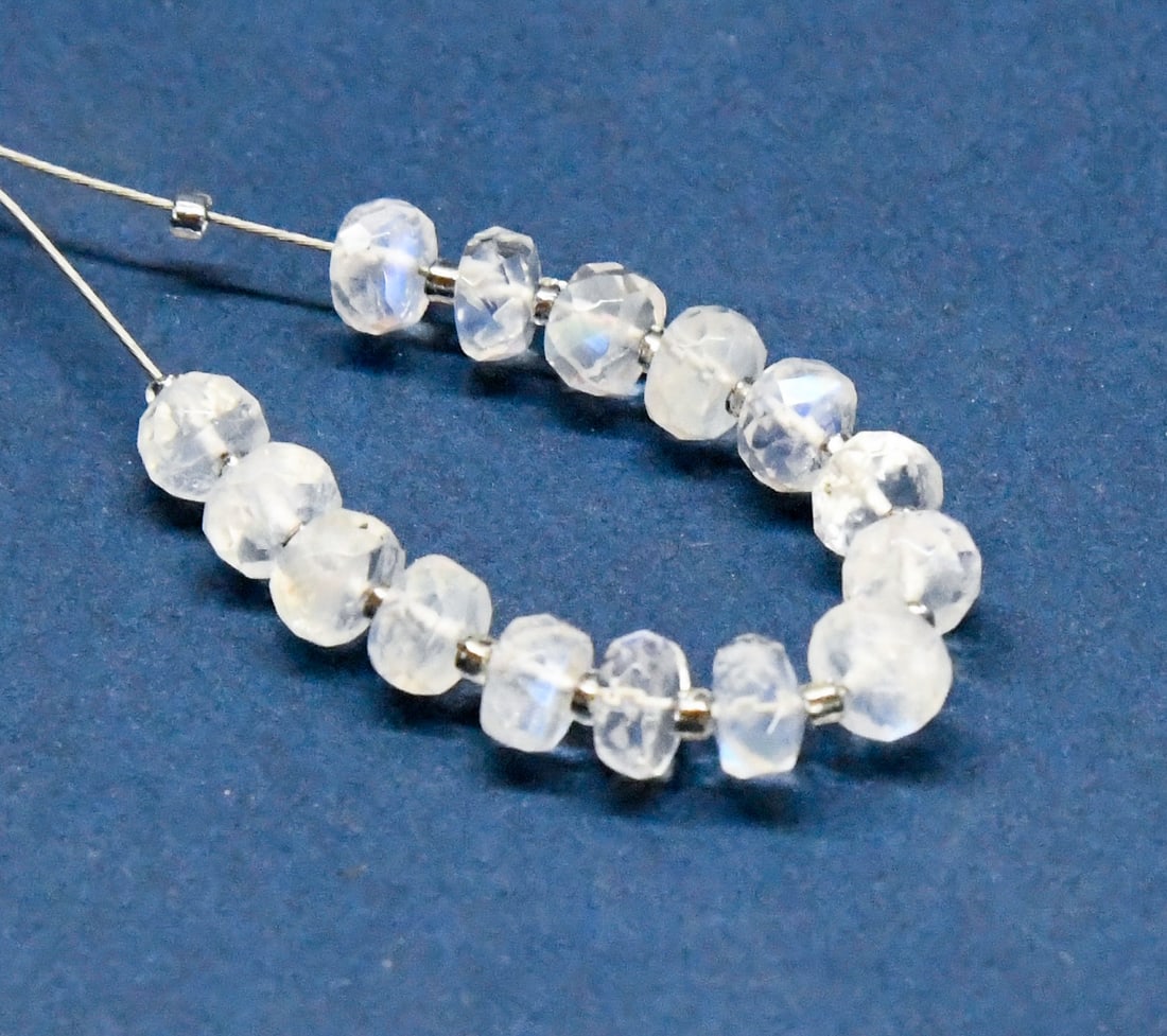 NATURAL RAINBOW MOONSTONE BEADS FACETED RONDELLE 4.5 - 5 MM 15 PCS (2 TASSELS): These are natural, earth mined and hand crafted with precision. Stone: Rainbow Moonstone, Shape: Faceted Rondelle, Size: 4.5 - 5 mm, Width: 2.5 - 3 mm, Weight: approx. 9.50 carats. The photographs are