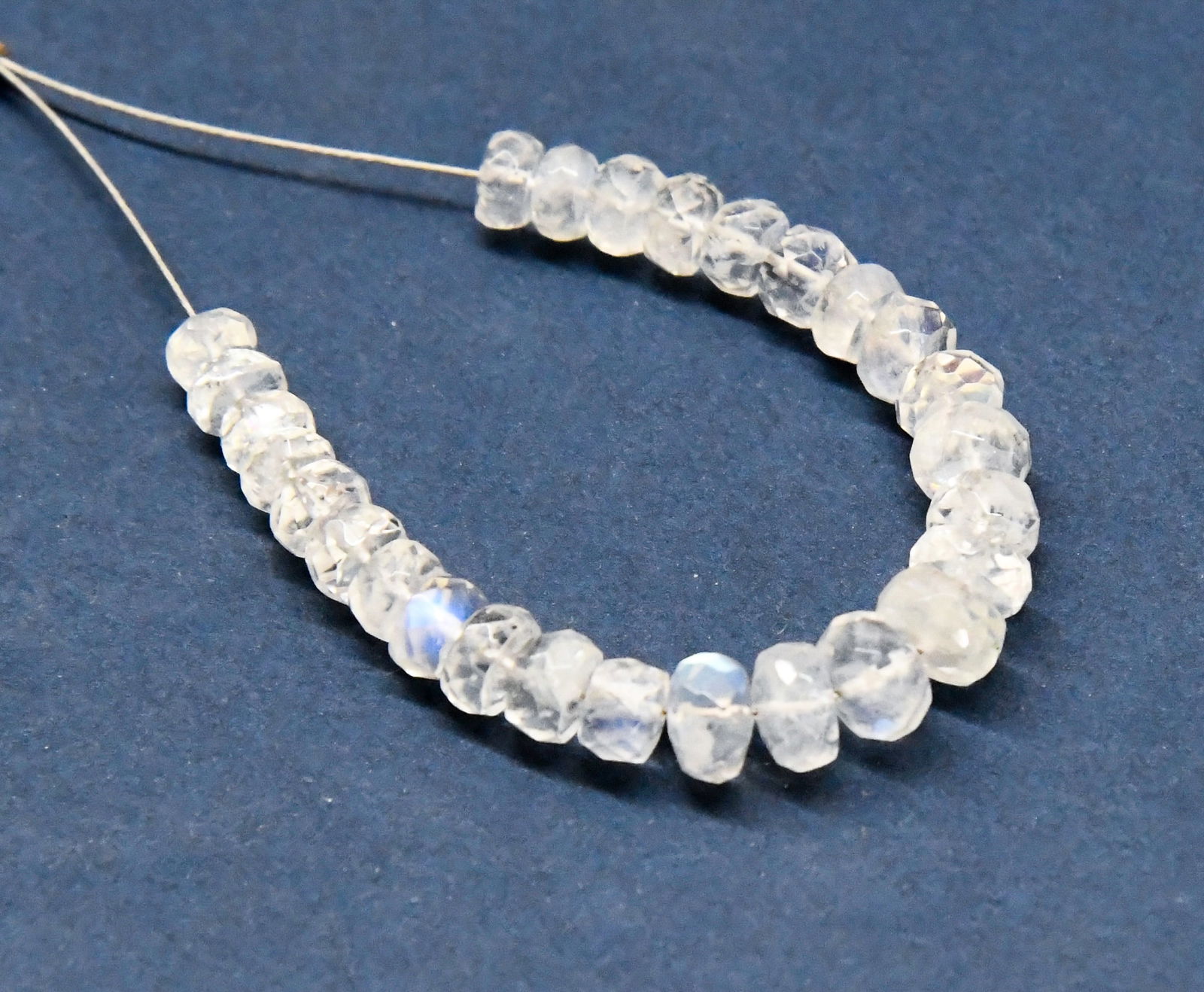 NATURAL RAINBOW MOONSTONE BEADS FACETED RONDELLE 3.5 - 4 MM 27 PCS: These are natural, earth mined and hand crafted with precision. Stone: Rainbow Moonstone, Shape: Faceted Rondelle, Size: 3.5 - 4 mm, Width: 2 - 3.5 mm, Weight: approx. 13 carats. The photographs are e