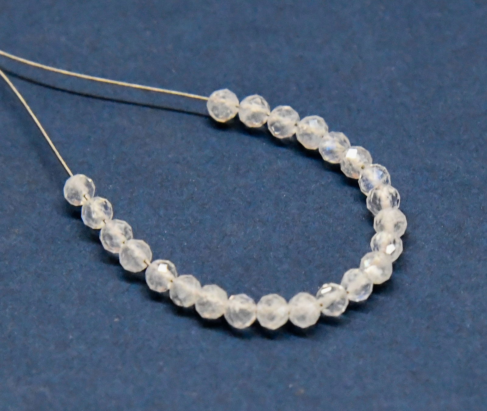 NATURAL RAINBOW MOONSTONE BEADS FACETED ROUND 3 MM 23 PCS: These are natural, earth mined and hand crafted with precision. Stone: Rainbow Moonstone, Shape: Faceted Round, Size: 3 mm, Weight: approx. 4 carats. The photographs are enlarged to show the clarity a