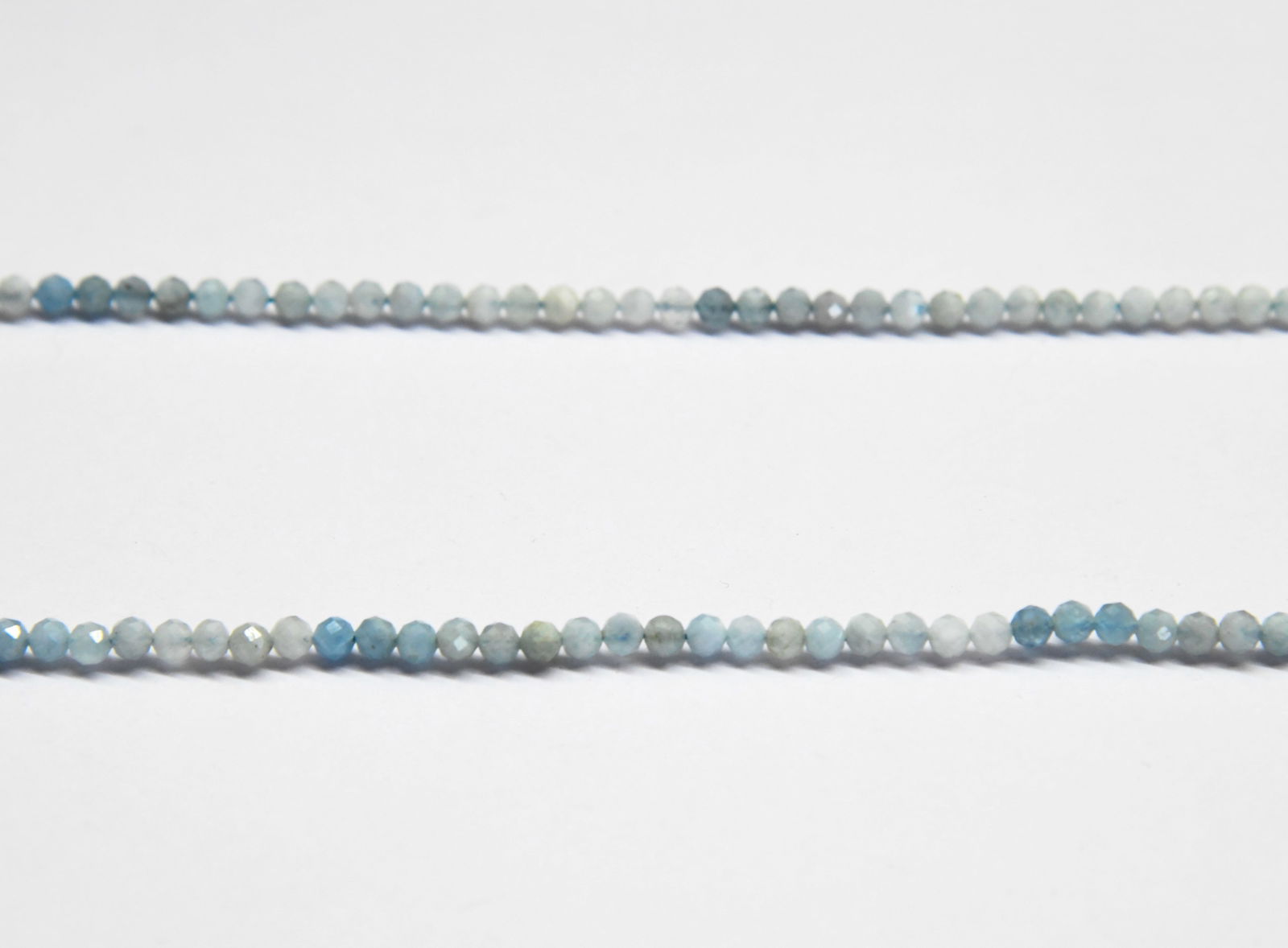 16" STRAND NATURAL AQUAMARINE BEADS(SHADED) FACETED ROUND 4 MM: These are natural, earth mined and hand crafted with precision. Stone: Aquamarine (Shaded), Stone Shape: Faceted Round, Stone Size: 4 mm, Length: 16", Weight: approx. 43 carats. The photographs are en