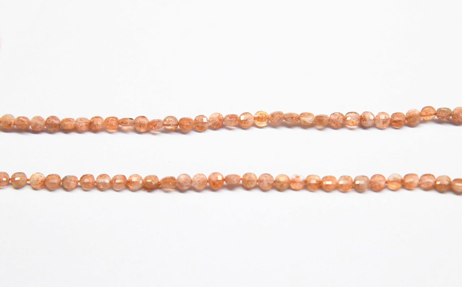16" STRAND NATURAL SUNSTONE BEADS FACETED COIN 4 MM: These are natural, earth mined and hand crafted with precision. Stone: Sunstone, Stone Shape: Faceted Coin, Stone Size: 4 mm, Width: 2 - 2.5 mm, Weight: approx. 31 carats. The photographs are enlarged