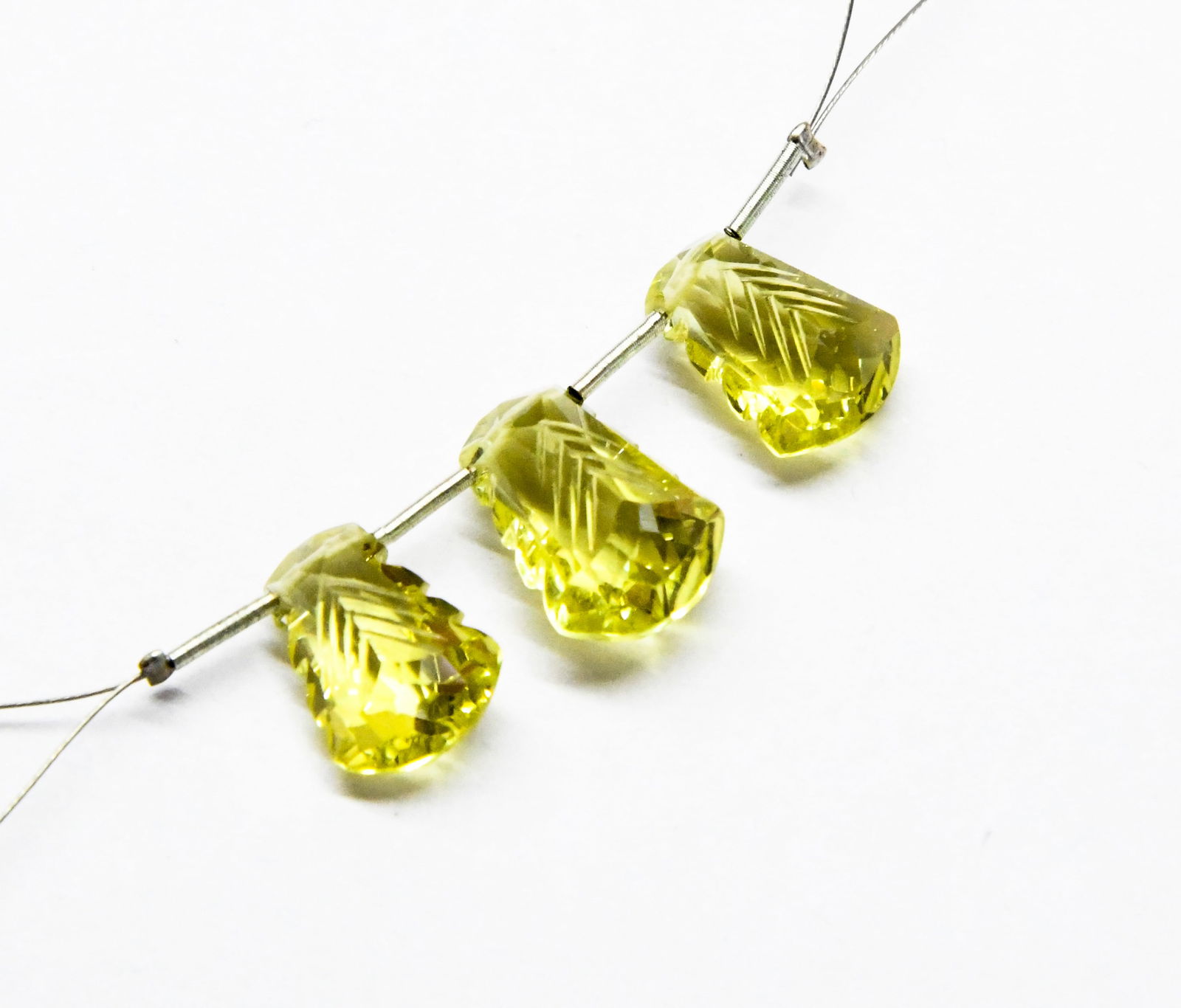 NATURAL LEMON QUARTZ CARVED FANCY 10X13 - 10X15 MM 3 PC: These are natural, earth mined and hand crafted with precision. Stone: Lemon Quartz, Stone Shape: Carved Fancy, Stone Size: 10x13.5 - 10.5x15 mm, Width: 6.5 - 8 mm, Weight: approx. 16 carats. The phot
