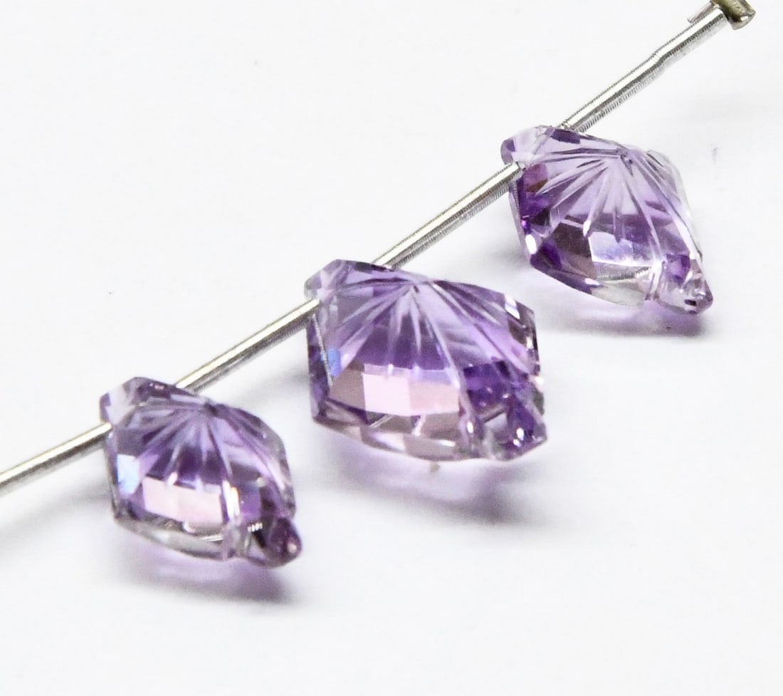 NATURAL AMETHYST CARVED FANCY 9X12 - 12X16 MM 3 PC: These are natural, earth mined and hand crafted with precision. Stone: Amethyst, Stone Shape: Carved Fancy, Stone Size: 9.5x12.5 - 12x16 mm, Width: 7 - 8 mm, Weight: approx. 12.40 carats. The photogra
