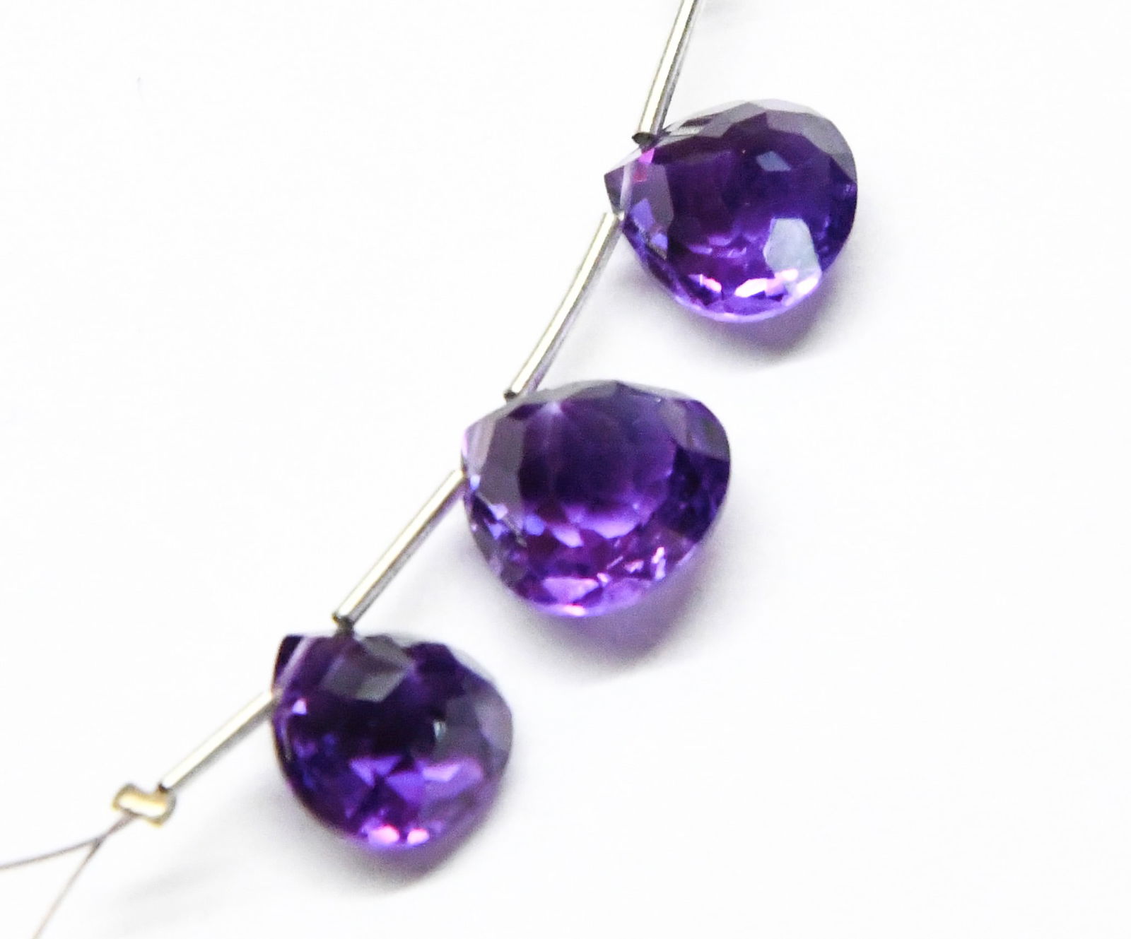 NATURAL AMETHYST BEADS FACETED HEART 10X11 MM 3 PC: These are natural, earth mined and hand crafted with precision. Stone: Amethyst, Stone Shape: Faceted Heart, Stone Size: 10x11 mm, Width: 6.5 - 7.5 mm, Weight: approx. 10.50 carats. The photographs ar