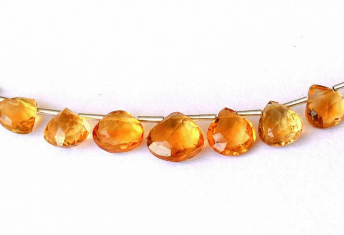 NATURAL CITRINE BEADS FACETED HEART 7 - 8 MM 7 PCS: These are natural, earth mined and hand crafted with precision. Stone: Citrine, Stone Shape: Faceted Heart, Stone Size: 7 - 8 mm, Weight: approx. 8 carats. The photographs are enlarged to show the cla
