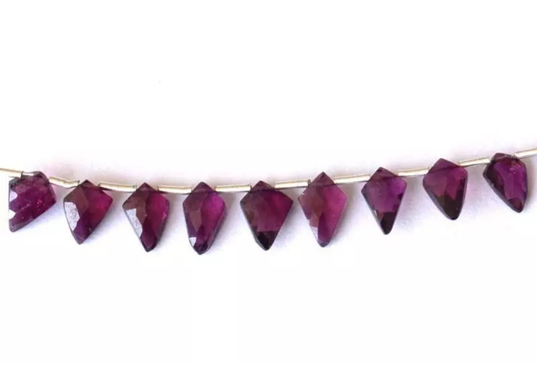NATURAL RHODOLITE GARNET BEADS FACETED FANCY 5X8 - 6X9 MM 9 PCS: These are natural, earth mined and hand crafted with precision. Stone: Rhodolite Garnet, Stone Shape: Faceted Fancy, Stone Size: 5x8 - 6x9 mm, Width - 2.5 - 3 mm, Weight: approx. 10 carats. The photog