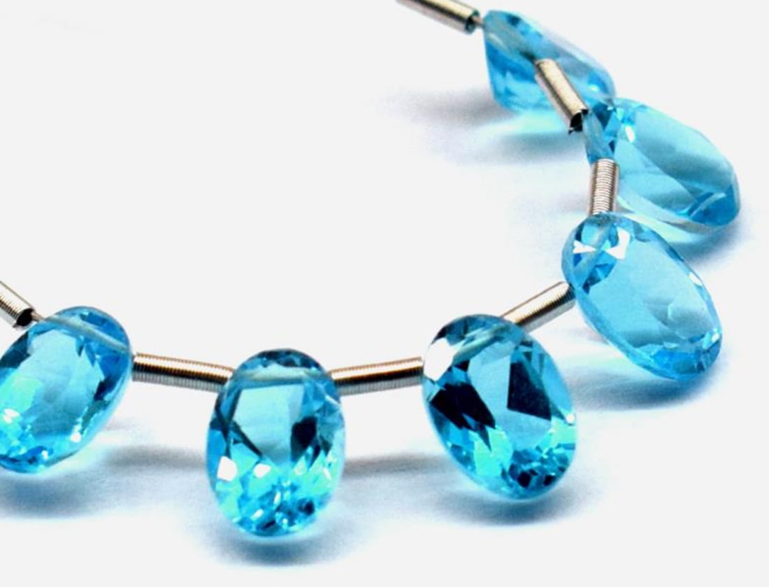 NATURAL SWISS BLUE TOPAZ BEADS FACETED OVAL 5X7 MM 6 PCS: These are natural, earth mined and hand crafted with precision. Stone: Swiss Blue Topaz, Stone Shape: Faceted Oval, Stone Size: 5x7 mm, Width: 3.5 - 4 mm, Weight: approx. 6 carats. The photographs