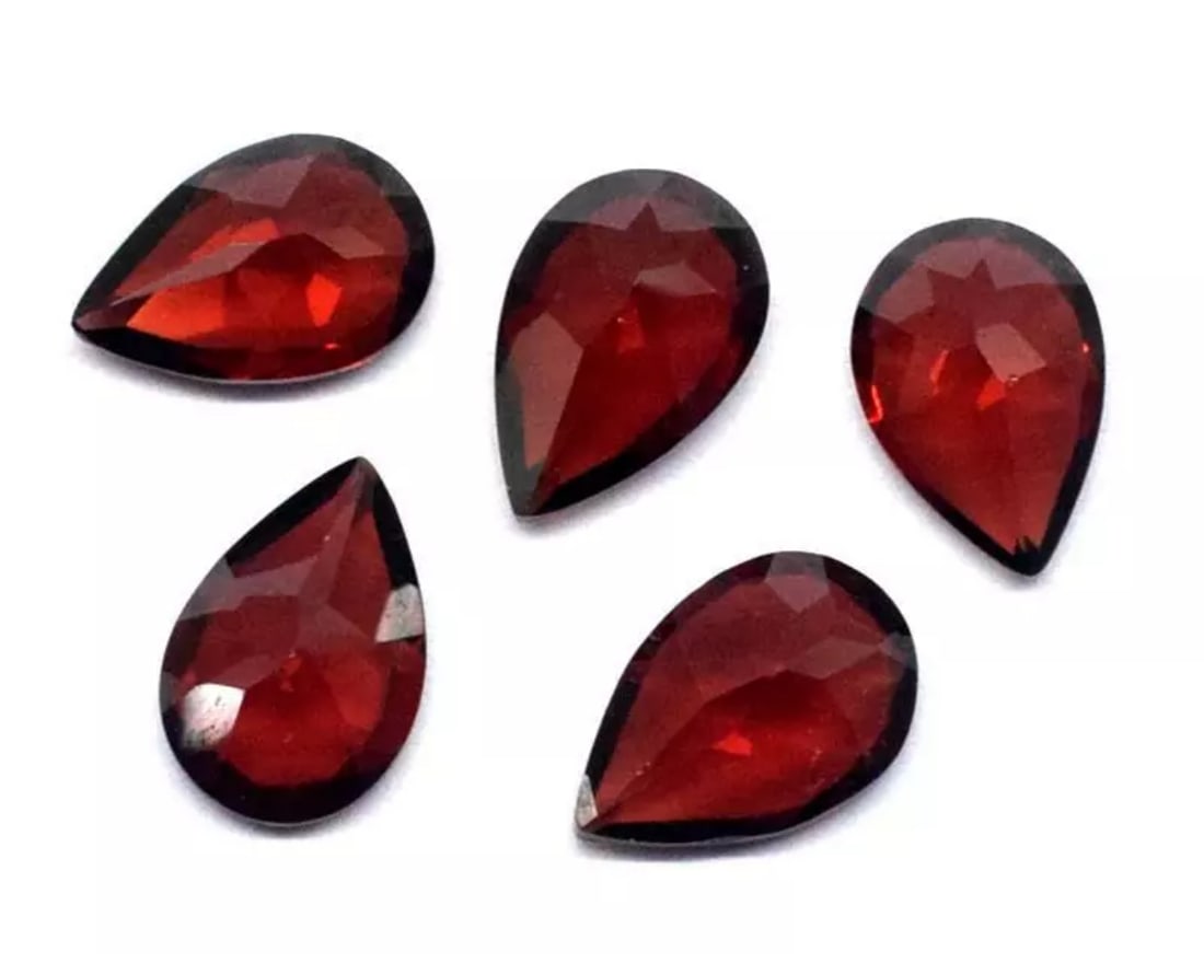 (5 PIECES) NATURAL GARNET FACETED CUTSTONE PEAR 7.5X11.5 - 8X12 MM: These are natural, earth mined and hand crafted with precision. Stone: Garnet, Stone Shape: Faceted Pear, Stone Size: 7.5x11 - 8x12 mm, Width - 4.5 - 5 mm, Weight: approx. 14 carats. The photographs