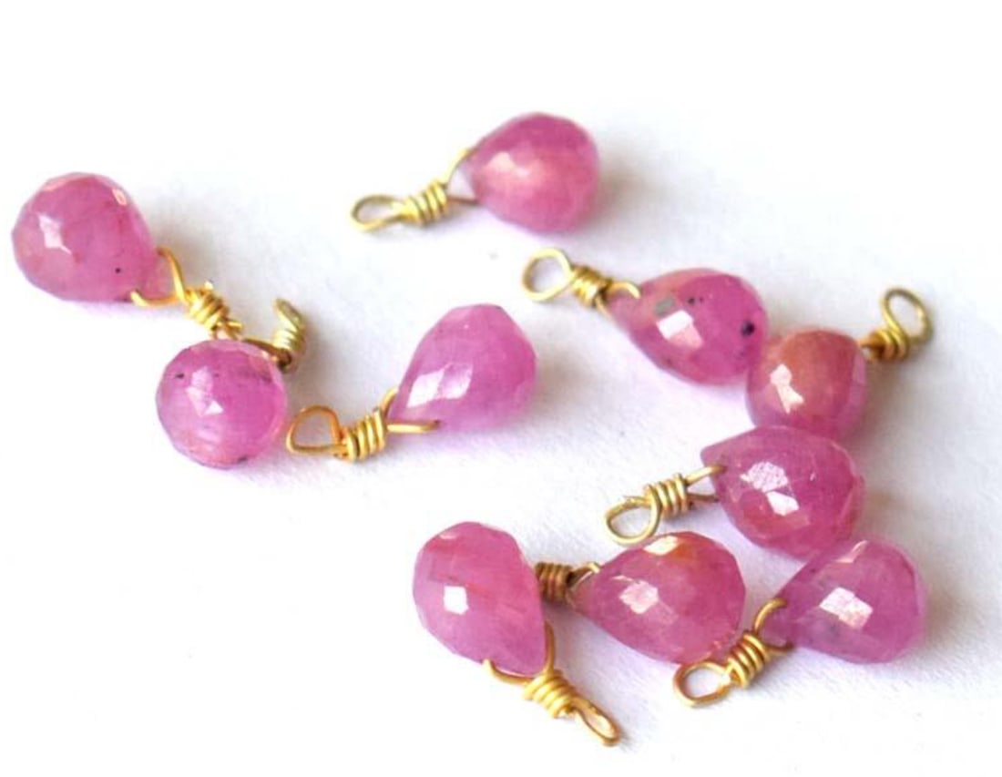 PINK SAPPHIRE BEADS FACETED BRIOLETTE 4X6 - 5X6 MM SOLID 925 SILVER 10PCS: These are natural, earth mined and hand crafted with precision. Stone: Pink Sapphire, Stone Shape: Faceted Briolette, Stone Size: 4.5x6.5 - 5x6 mm, Weight: approx. 16 carats. The photographs are enlar