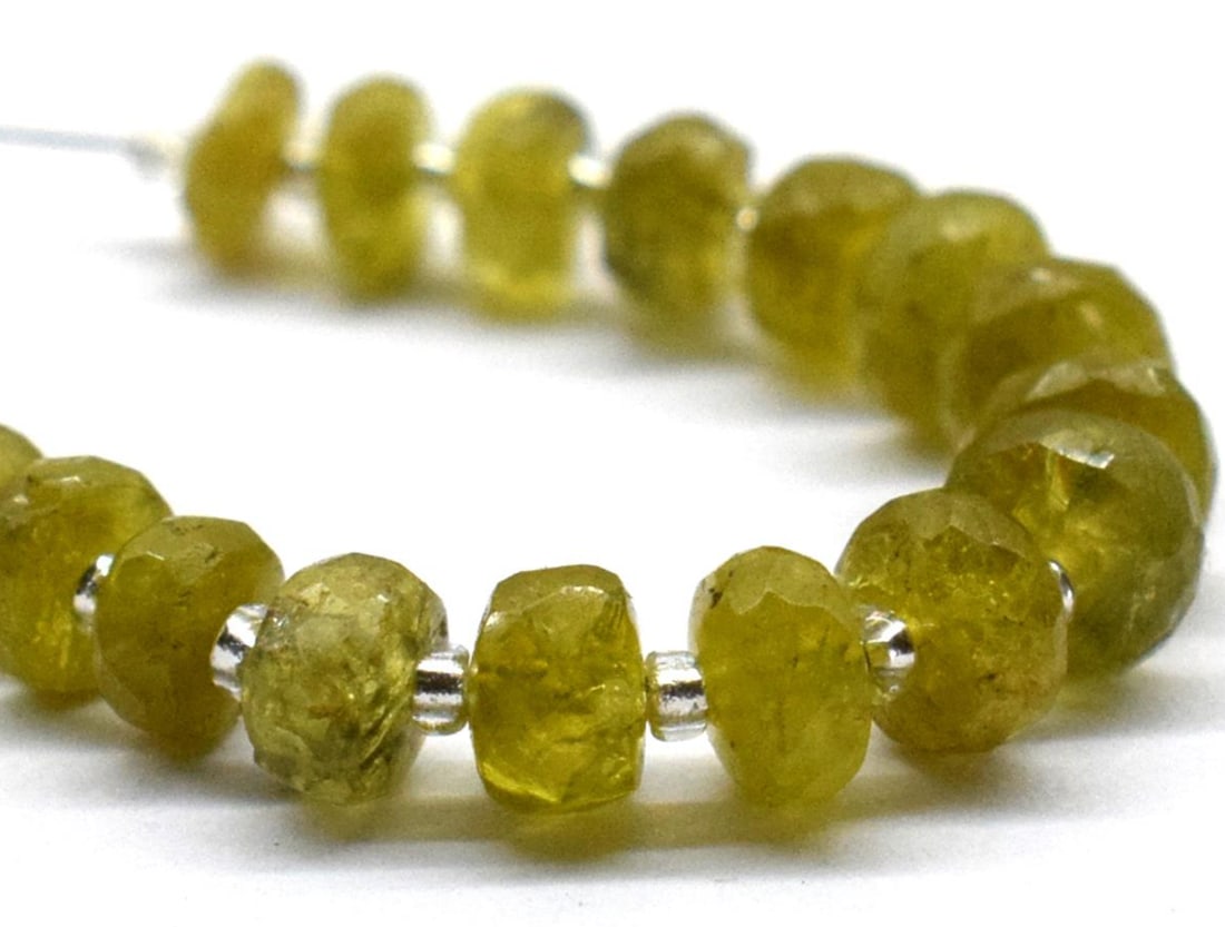 NATURAL CHRYSOBERYL BEADS FACETED RONDELLE 4 - 5.5 MM 19 PCS: These are natural, earth mined and hand crafted with precision. Stone: Chrysoberyl, Stone Shape: Faceted Rondelle, Stone Size: 4 - 5.5 mm, Width: 2 - 3 mm, Weight: approx. 12.50 carats. The photograph