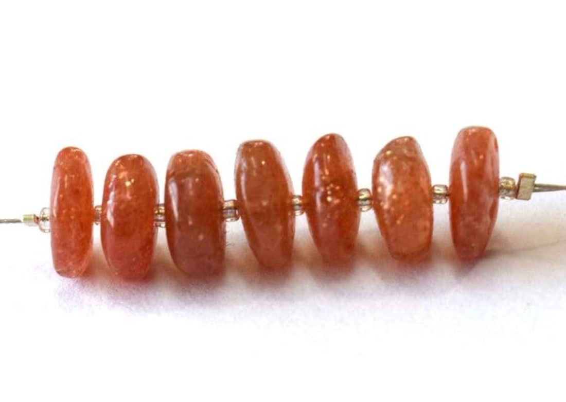 NATURAL SUNSTONE BEADS RONDELLE 9.5 - 10 MM 7 PCS: These are natural, earth mined and hand crafted with precision. Stone: Sunstone, Stone Shape: Rondelle, Stone Size: 9.5 - 10 mm, Width: 4 mm, Weight: approx. 21 carats. The photographs are enlarged to