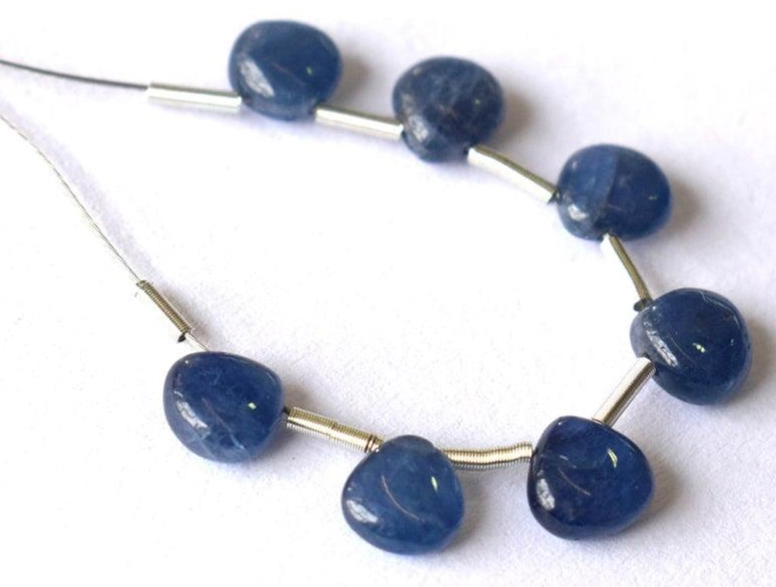 NATURAL BLUE SAPPHIRE BEADS HEART 5.5 - 6 MM 7 PCS: These are natural, earth mined and hand crafted with precision. Stone: Sapphire, Stone Shape: Heart, Stone Size: 5.5 - 6 mm, Width: 2.5 - 3 mm, Weight: approx. 8 carats. The photographs are enlarged t