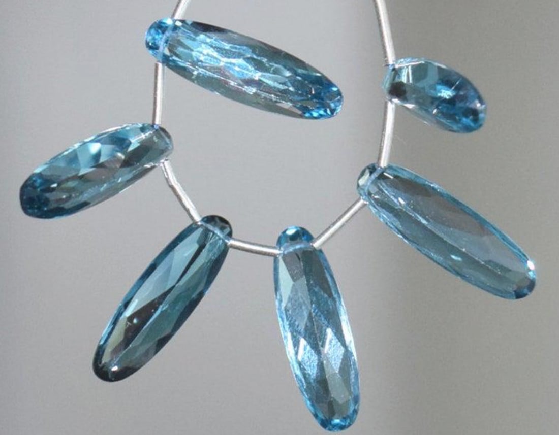 NATURAL LONDON BLUE TOPAZ BEADS FACETED OVAL 6X19.5 - 6X20 MM 6 PCS: These are natural, earth mined and hand crafted with precision. Stone: London Blue Topaz, Stone Shape: Faceted Fancy, Stone Size: 6x19.5 - 6x20 mm, Width: 3.5 - 5.5 mm, Weight: approx. 30 carats. The