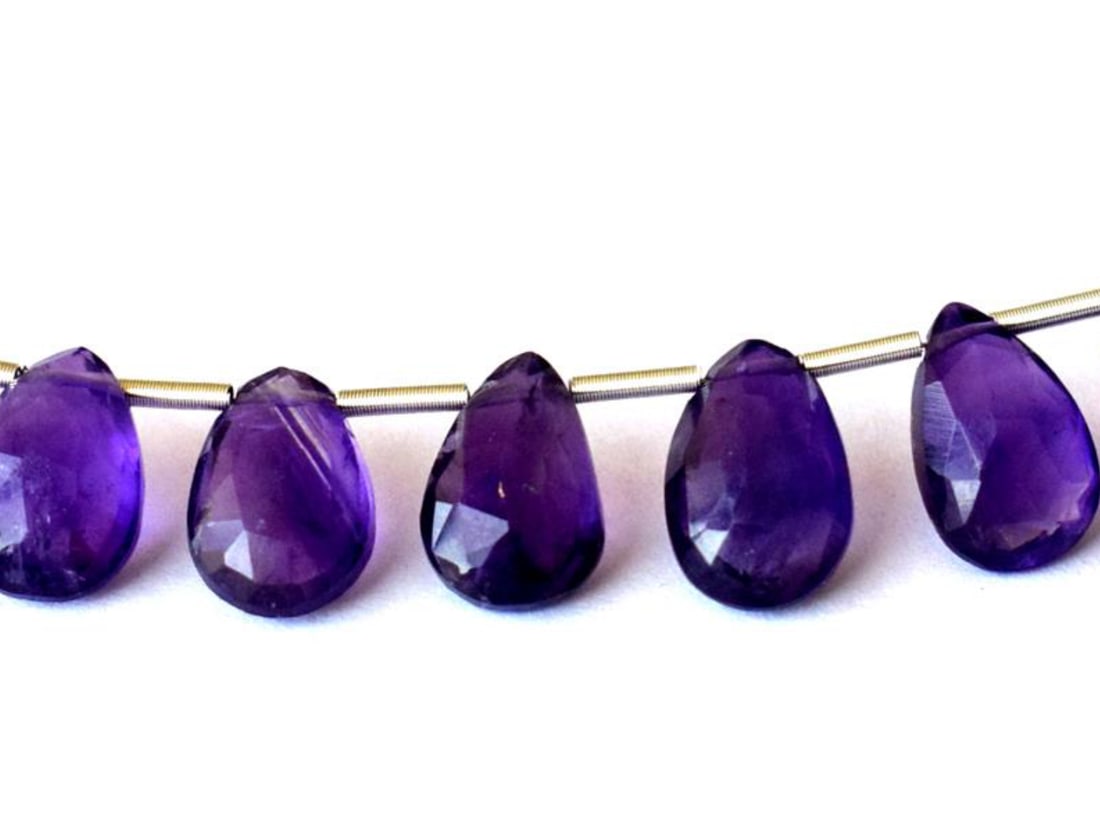 NATURAL AMETHYST BEADS FACETED PEAR 6X9 - 7X10 MM 9 PCS: These are natural, earth mined and hand crafted with precision. Stone: Amethyst, Stone Shape: Faceted Pear, Stone Size: 6x9 - 7x10mm, Width: 4 - 5 mm, Weight: approx. 18 carats. The photographs are en