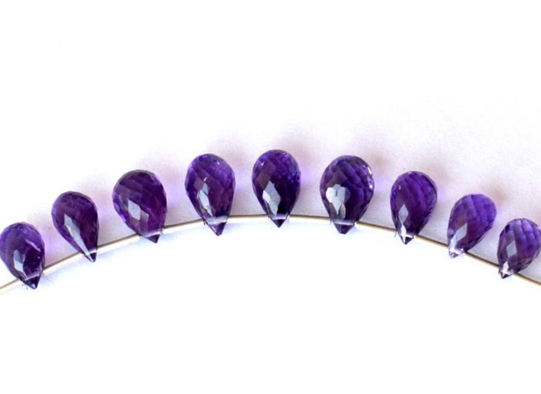 NATURAL AMETHYST BEADS FACETED BRIOLETTE 5X7.5 - 6X10MM 9 PCS: These are natural, earth mined and hand crafted with precision. Stone: Amethyst, Stone Shape: Faceted Briolette, Stone Size: 5x7.5 - 6x10 mm, Weight: approx. 16 carats. The photographs are enlarged to