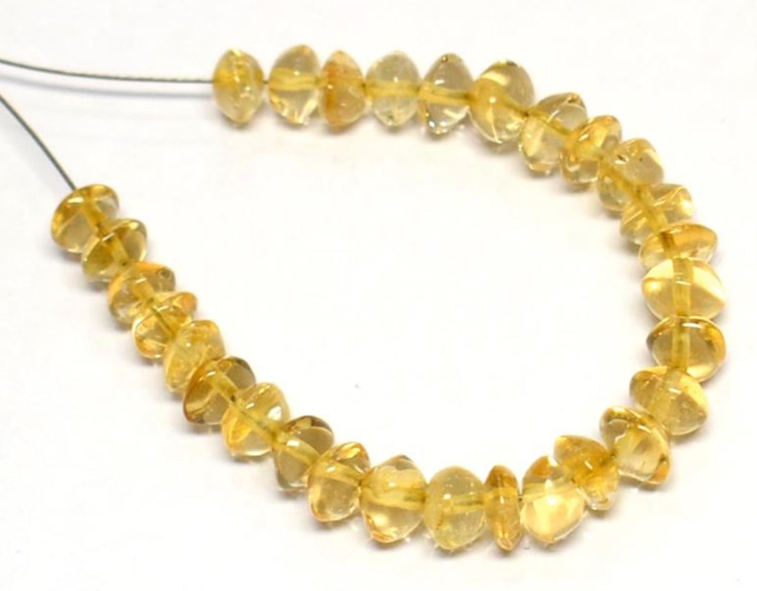 NATURAL CITRINE BEADS RONDELLE 4 - 4.5 MM 29 PCS (2 TASSELS): These are natural, earth mined and hand crafted with precision. Stone: Citrine, Stone Shape: Rondelle, Stone Size: 4 - 4.5 mm, Width: 2 - 3 mm, Weight: approx. 11.50 carats. The photographs are enlarg