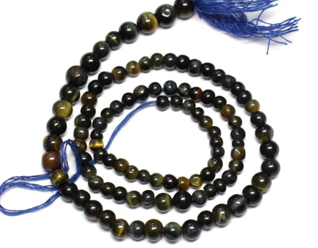13.5" STRAND NATURAL TIGER' EYE BEADS ROUND 3 - 5 MM: These are natural, earth mined and hand crafted with precision. Stone: Tigers Eye, Stone Shape: Round, Stone Size: 3 - 5 mm, Weight: approx. 43 carats. The photographs are enlarged to show the clarity