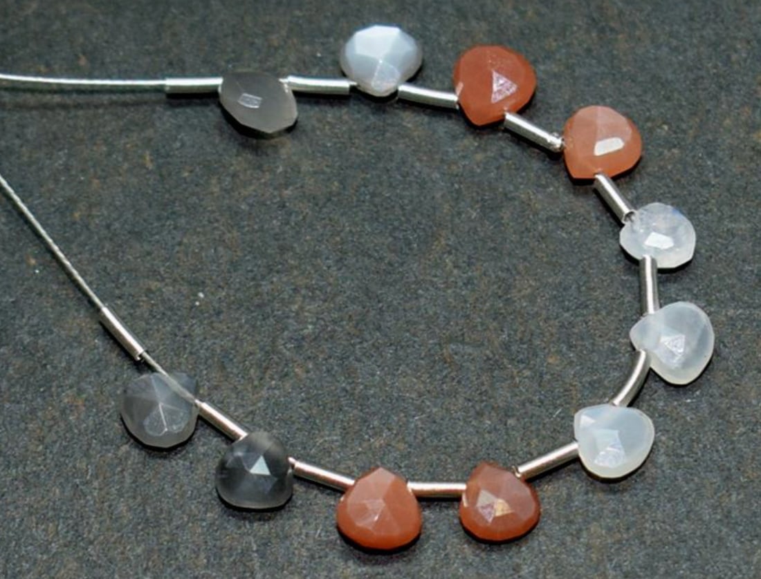 NATURAL MULTI MOONSTONE BEADS FACETED HEART 4.5 - 5 MM 11 PCS: These are natural, earth mined and hand crafted with precision. Stone: Multi Moonstone, Stone Shape: Faceted Heart, Stone Size: 4.5 - 5 mm, Width: 2 - 2.5 mm, Weight: approx. 4.50 carats. The photogra