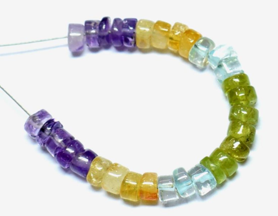 NATURAL MULTI 4 COLOR BEADS TYRE 4 - 4.5 MM 31 PCS (3 TASSELS): These are natural, earth mined and hand crafted with precision. Stone: Multi Moonstone, Stone Shape: Tyre, Stone Size: 4 - 4.5 mm, Width: 1.5 - 3 mm, Weight: approx. 14 carats. The photographs are enl