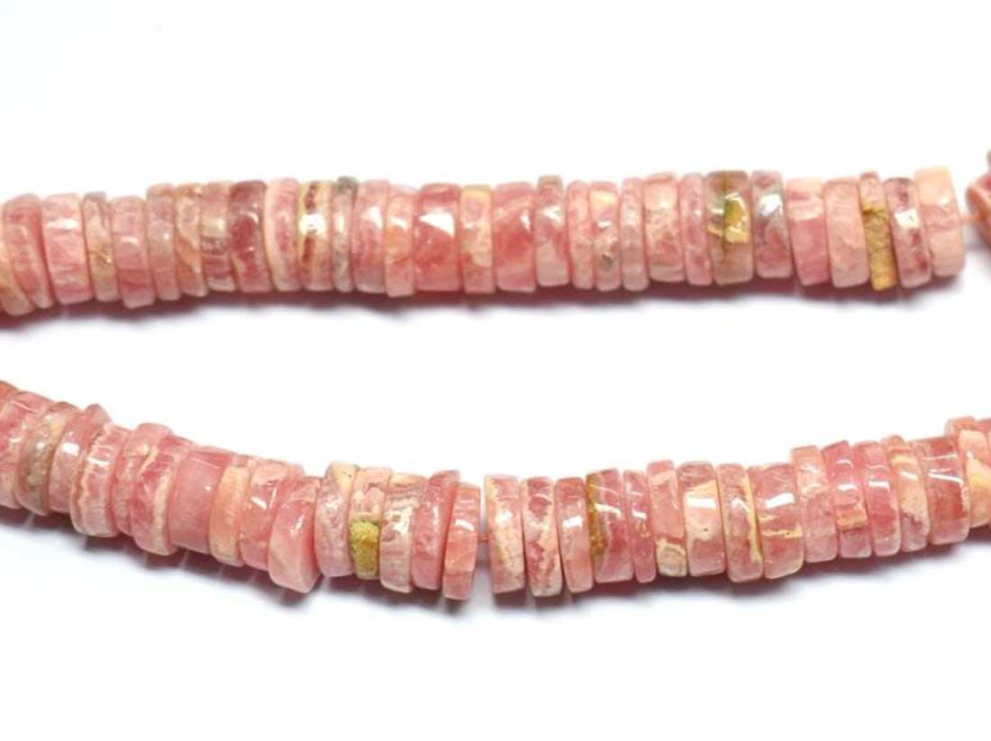 16" STRAND NATURAL RHODOCHROSITE BEADS TYRE 7 - 7.5 MM 1 LINE: These are natural, earth mined and hand crafted with precision. Stone: Rhodochrosite, Stone Shape: Tyre, Stone Size: 6.5 - 7.5 mm, Width: 1.5 - 2.5 mm, Weight: approx. 272 carats. The photographs are