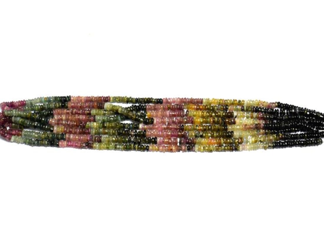 16" STRAND NATURAL MULTI TOURMALINE BEADS TYRE 4 - 4.5 MM 1 LINE: These are natural, earth mined and hand crafted with precision. Stone: Multi Tourmaline, Stone Shape: Tyre, Stone Size: 4 - 4.5 mm, Width: 1 - 2 mm, Length: 16", Weight: approx. 76 carats. The photogr