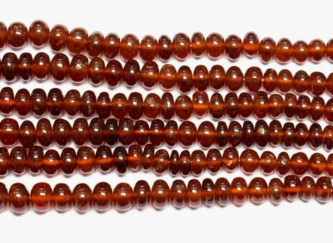 18" STRAND NATURAL HESSONITE GARNET BEADS RONDELLE 4.5 - 9 MM 1 LINE: These are natural, earth mined and hand crafted with precision. Stone: Hessonite Garnet, Stone Shape: Rondelle, Stone Size: 4.5 - 9 mm, Width: 3 - 5 mm, Weight: approx. 231 carats. The photographs are