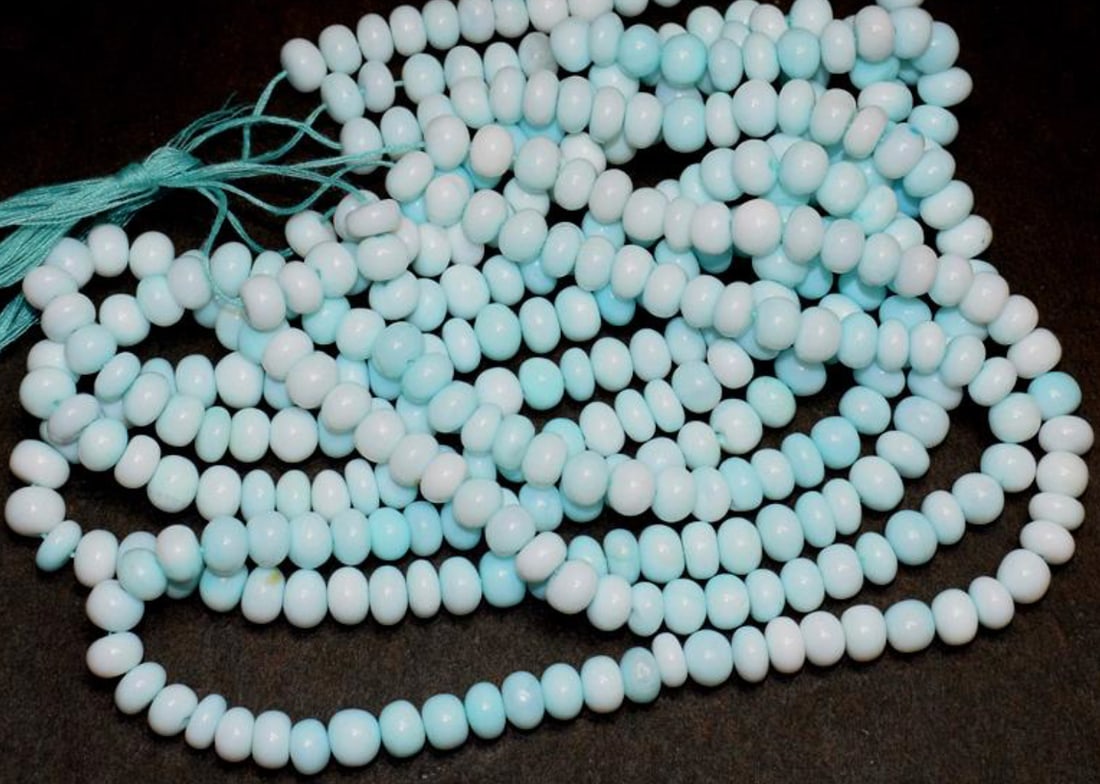 18" STRAND BLUE OPAL (DYED) BEADS RONDELLE 7 MM 1 LINE: These are natural, earth mined and hand crafted with precision. Stone: Blue Opal (Dyed), Stone Shape: Rondelle, Stone Size: 7 mm, Width: 3 - 6 mm, Weight: approx. 147 carats. The photographs are enlar