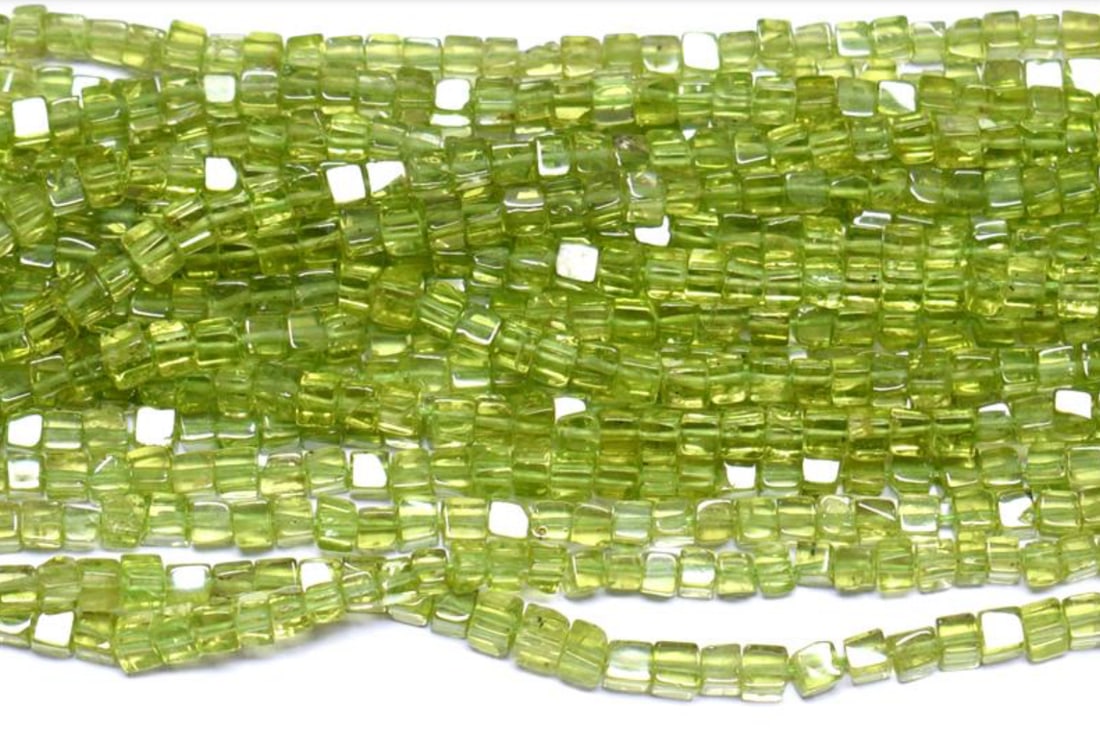 16" STRAND NATURAL PERIDOT BEADS BOX 2.5 - 3 MM 1 LINE: These are natural, earth mined and hand crafted with precision. Stone: Peridot, Stone Shape: Box, Stone Size: 2.5 - 3 mm, Weight: approx. 54 carats. The photographs are enlarged to show the clarity an