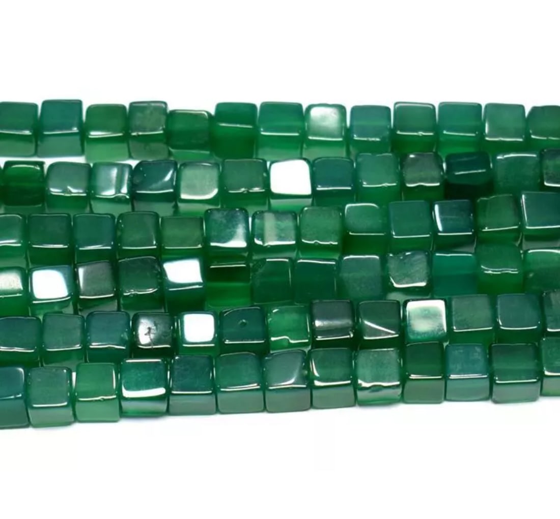 16" STRAND NATURAL GREEN ONYX BEADS BOX 5 - 6.5 MM 1 LINE: These are natural, earth mined and hand crafted with precision. Stone: Green Onyx, Stone Shape: Box, Stone Size: 5 - 6.5 mm, Weight: approx. 152 carats. The photographs are enlarged to show the clarit