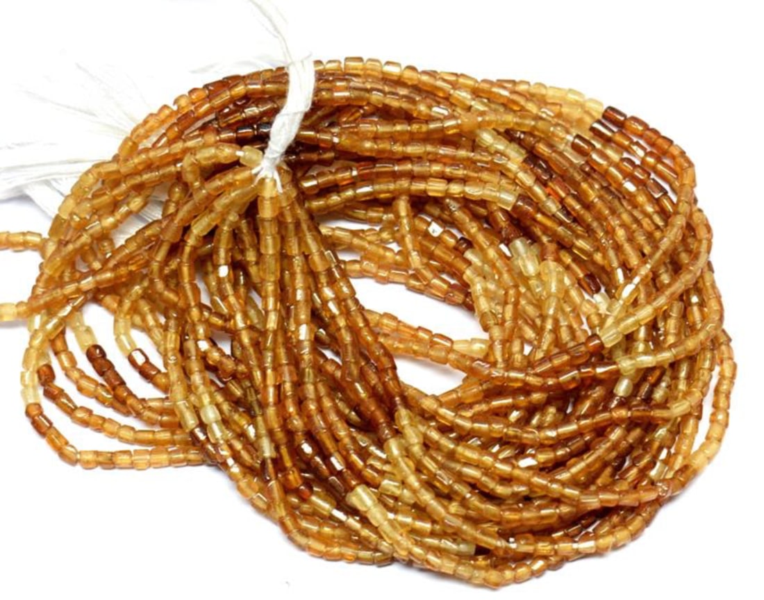 13" STRAND NATURAL HESSONITE GARNET BEADS TUBE 2X2 - 2X3 MM 1 LINE: These are natural, earth mined and hand crafted with precision. Stone: Hessonite Garnet, Stone Shape: Tube, Stone Size: 2x2 - 2x3 mm, Weight: approx. 19 carats. The photographs are enlarged to show th
