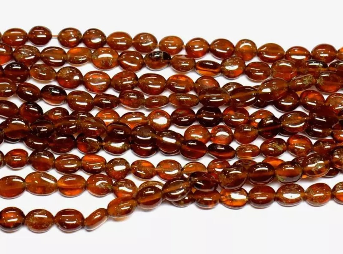 15.5" STRAND NATURAL HESSONITE GARNET BEADS OVAL 6X7 - 6.5X8 MM 1 LINE (1 of 2)