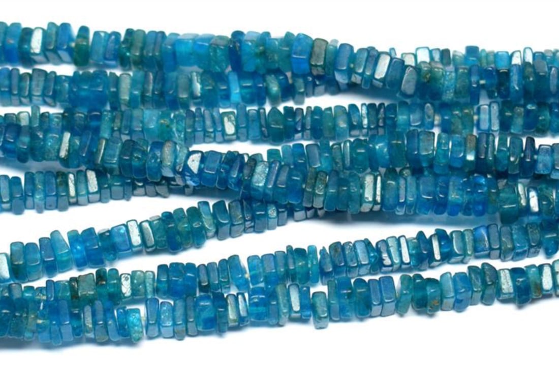 16" STRAND NATURAL NEON APATITE BEADS FLAT SQUARE 3.5 - 4 MM 1 LINE: These are natural, earth mined and hand crafted with precision. Stone: Neon Apatite, Stone Shape: Flat Square, Stone Size: 3.5 - 4 mm, Width: 1 - 2 mm, Weight: approx. 79 carats. The photographs are e