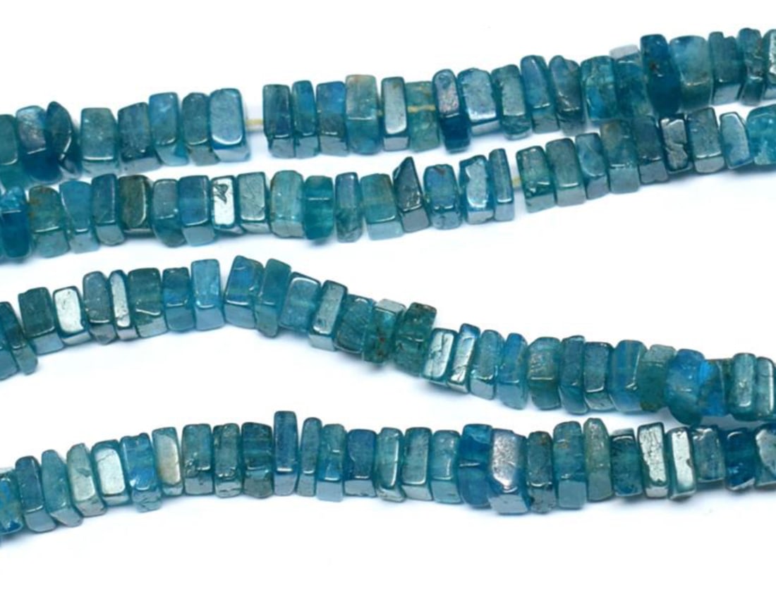 16" STRAND NATURAL NEON APATITE BEADS FLAT SQUARE 5 - 5.5 MM 1 LINE: These are natural, earth mined and hand crafted with precision. Stone: Neon Apatite, Stone Shape: Flat Square, Stone Size: 5 - 5.5 mm, Width: 1.5 - 2.5 mm, Weight: approx. 145 carats. The photographs