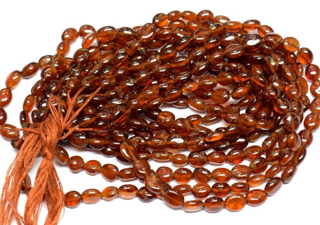 15.5" STRAND NATURAL HESSONITE GARNET BEADS OVAL 5X5.5 - 5X7 MM 1 LINE (1 of 1)