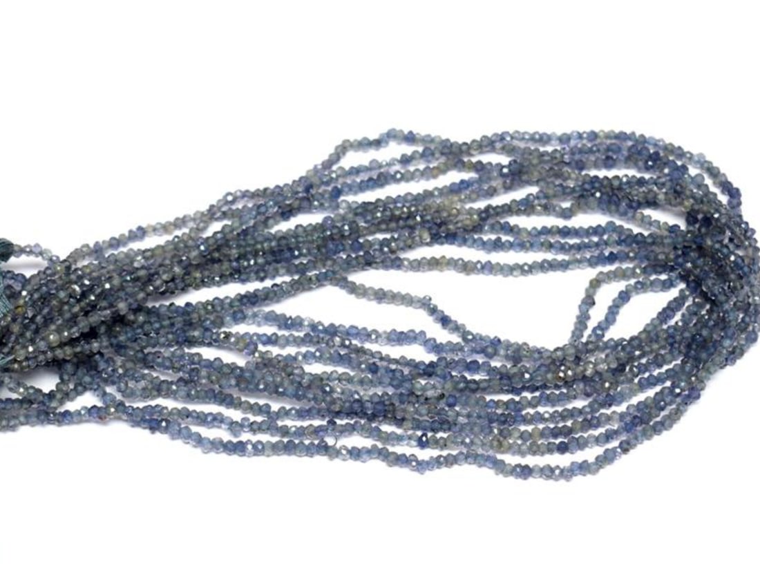 12" STRAND NATURAL IOLITE BEADS FACETED RONDELLE 2.5 MM 1 LINE: These are natural, earth mined and hand crafted with precision. Stone: Iolite, Stone Shape: Faceted Rondelle, Stone Size: 2.5 mm, Width: 1.5 - 2 mm, Weight: approx. 14 carats. The photographs are enla