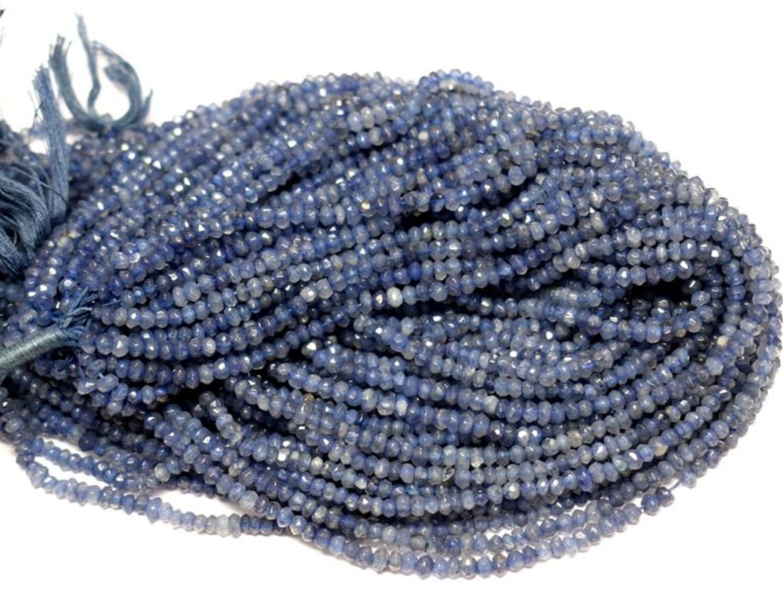 12" STRAND IOLITE (DYED) BEADS FACETED RONDELLE 3 - 3.5 MM 1 LINE: These are natural, earth mined and hand crafted with precision. Stone: Iolite, Stone Shape: Faceted Rondelle, Stone Size: 3 - 3.5 mm, Width: 2 - 3 mm, Weight: approx. 27 carats. The photographs are en