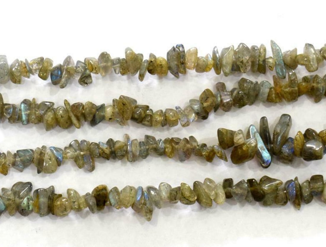 34" NATURAL LABRADORITE BEADS CHIPS 2.5X3.5 - 5X9 MM 1 LINE: These are natural, earth mined and hand crafted with precision. Stone: Labradorite, Stone Shape: Chips, Stone Size: 2.5x3.5 - 5x9 mm, Width: 1.5 - 4 mm, Weight: approx. 182 carats. The photographs are